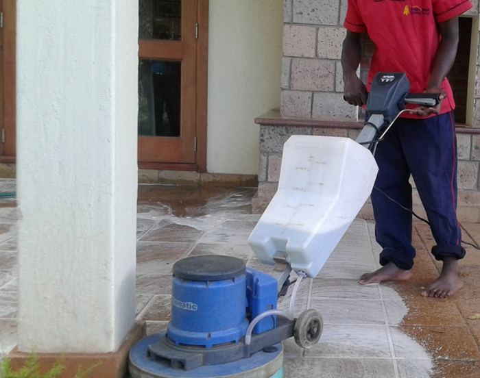 Cleaning team member with equipment